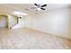 A spacious living room boasting tile floors, a modern staircase, and decorative light fixtures at 2520 Bella Vista Dr, Davenport, FL 33897