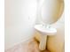 Powder room features a pedestal sink, oval mirror, and tile flooring at 2520 Bella Vista Dr, Davenport, FL 33897