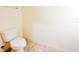 A close-up view of a standard white toilet with neutral wall and tile flooring at 2520 Bella Vista Dr, Davenport, FL 33897