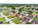 An aerial view of the neighborhood featuring lush lawns, mature trees, and houses with well-maintained exteriors at 314 Edgewood Ct, Kissimmee, FL 34759