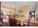 Spacious dining area featuring a large table, connecting to other living spaces for an open and airy feel at 314 Edgewood Ct, Kissimmee, FL 34759