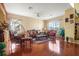 Bright living room with comfortable seating, ceiling fan, and natural light, creating a welcoming space at 314 Edgewood Ct, Kissimmee, FL 34759