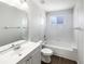 Clean, all white bathroom featuring a shower-tub combination and modern fixtures at 3142 Britannia Blvd # C, Kissimmee, FL 34747