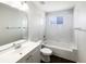 Clean bathroom with a tub, shower, and large mirror above the sink at 3142 Britannia Blvd # C, Kissimmee, FL 34747