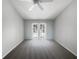 Bedroom with a ceiling fan and access to a private balcony at 3142 Britannia Blvd # C, Kissimmee, FL 34747