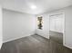 Cozy bedroom with mirrored closet doors and a sunlit window at 3142 Britannia Blvd # C, Kissimmee, FL 34747