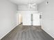 Neutral bedroom with ceiling fan and access to the bathroom at 3142 Britannia Blvd # C, Kissimmee, FL 34747