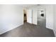 Comfortable bedroom featuring mirrored closet doors and neutral carpeting at 3142 Britannia Blvd # C, Kissimmee, FL 34747