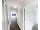 Hallway view leading to the front living area with a large window at 3142 Britannia Blvd # C, Kissimmee, FL 34747
