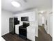 Compact kitchen featuring stainless steel appliances and white cabinetry at 3142 Britannia Blvd # C, Kissimmee, FL 34747