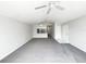 Open-concept living area with carpet and a view into the kitchen at 3142 Britannia Blvd # C, Kissimmee, FL 34747