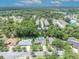 Areal view of a home with in-ground pool surrounded by trees at 320 Bridle Path, Casselberry, FL 32707