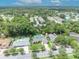 Areal view of a home with in-ground pool surrounded by trees at 320 Bridle Path, Casselberry, FL 32707