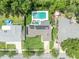 An aerial view of the home's roof with solar panels and backyard pool at 320 Bridle Path, Casselberry, FL 32707