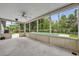 A screened patio overlooks a sparkling pool and lush backyard at 320 Bridle Path, Casselberry, FL 32707
