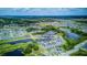 Expansive aerial view of a community, highlighting the numerous ponds and lush surroundings, showcasing its location at 322 Annabelle Way, Davenport, FL 33837