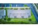 An aerial view of rooftops, community parking, and greenery, offering a glimpse of community layout and features at 322 Annabelle Way, Davenport, FL 33837