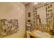 Stylish bathroom features unique mirror, granite countertop, and decorative accents at 322 Annabelle Way, Davenport, FL 33837