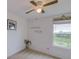 Bright bedroom featuring natural light, neutral carpet, and charming decor at 322 Annabelle Way, Davenport, FL 33837