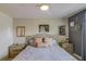 Bedroom features a cozy bed, two nightstands, and tasteful decor with a calming ambiance at 322 Annabelle Way, Davenport, FL 33837