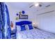 Well-lit bedroom boasts stylish decor, a ceiling fan, and ample closet space at 322 Annabelle Way, Davenport, FL 33837