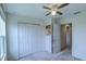 Neutral bedroom featuring carpet, closet space, and access to the hallway at 322 Annabelle Way, Davenport, FL 33837