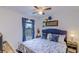 Charming bedroom with bright natural light, a ceiling fan, and serene views at 322 Annabelle Way, Davenport, FL 33837