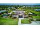 View of a pool and clubhouse surrounded by landscaping, offering a glimpse of community recreational amenities at 322 Annabelle Way, Davenport, FL 33837