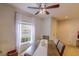 Bright dining area with a ceiling fan, window, and seating for four at 322 Annabelle Way, Davenport, FL 33837