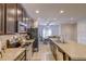 Modern kitchen featuring stainless steel appliances, tiled backsplash, and granite countertops at 322 Annabelle Way, Davenport, FL 33837