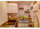 Efficient laundry room featuring shelving, machines, and stylish decor at 322 Annabelle Way, Davenport, FL 33837