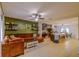 Open concept living room with tiled flooring and seamless transition to kitchen and dining area at 322 Annabelle Way, Davenport, FL 33837