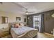 Well-decorated main bedroom featuring a comfortable bed, stylish curtains, and decorative wall art at 322 Annabelle Way, Davenport, FL 33837