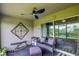 Cozy patio with ceiling fan, outdoor seating, and a grill perfect for relaxation and entertainment at 322 Annabelle Way, Davenport, FL 33837