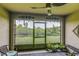 Inviting patio with a ceiling fan and a view of the lush green yard, perfect for relaxation at 322 Annabelle Way, Davenport, FL 33837