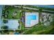Aerial view of community pool and clubhouse, showing the layout of the pool and the surrounding recreational facilities at 322 Annabelle Way, Davenport, FL 33837