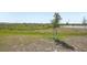 The spacious backyard of a new home is freshly graded and ready for the new owner at 3253 Viceroy Ct, Poinciana, FL 34759