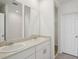 Bathroom includes dual sinks, a large mirror, and a door to the walk in closet at 3253 Viceroy Ct, Poinciana, FL 34759