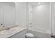 Bathroom featuring shower and bathtub combination with a showerhead and marble countertop at 3253 Viceroy Ct, Poinciana, FL 34759