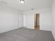 The cozy bedroom includes plush carpeting and doorways to other rooms at 3253 Viceroy Ct, Poinciana, FL 34759