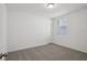 Bedroom with neutral carpet and paint as well as a window at 3253 Viceroy Ct, Poinciana, FL 34759