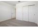 Bedroom featuring neutral carpet, closet with double doors and doorway to other room at 3253 Viceroy Ct, Poinciana, FL 34759