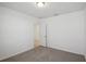 Bedroom with neutral carpet and paint as well as a doorway to the rest of the house at 3253 Viceroy Ct, Poinciana, FL 34759