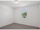 Bedroom with neutral carpet and paint with view from window at 3253 Viceroy Ct, Poinciana, FL 34759