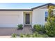 Well-maintained home features a manicured lawn and brick walkway leading to a modern, inviting front door at 3253 Viceroy Ct, Poinciana, FL 34759