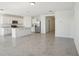 Bright, open kitchen/living space features modern appliances and an island, perfect for entertaining and everyday living at 3253 Viceroy Ct, Poinciana, FL 34759