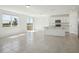 Modern kitchen with white cabinetry, stainless steel appliances, and an open layout for seamless entertaining at 3253 Viceroy Ct, Poinciana, FL 34759