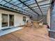 Relax on this back porch with a hammock and wood furniture under a corrugated roof at 3325 Horseshoe Dr, Longwood, FL 32779