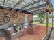 Outdoor patio featuring stylish seating, string lights, and a mounted bike, enhancing the backyard experience at 3325 Horseshoe Dr, Longwood, FL 32779