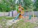 Playground equipment and a storage shed stand in the backyard of this home at 3325 Horseshoe Dr, Longwood, FL 32779